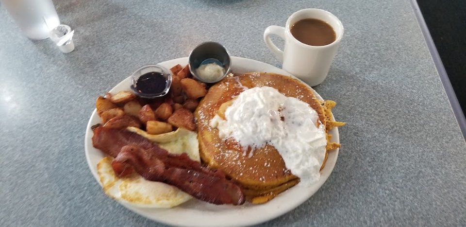 Printed menu with breakfast and brunch sections.